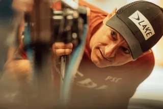 PSC technician focused on a bike service